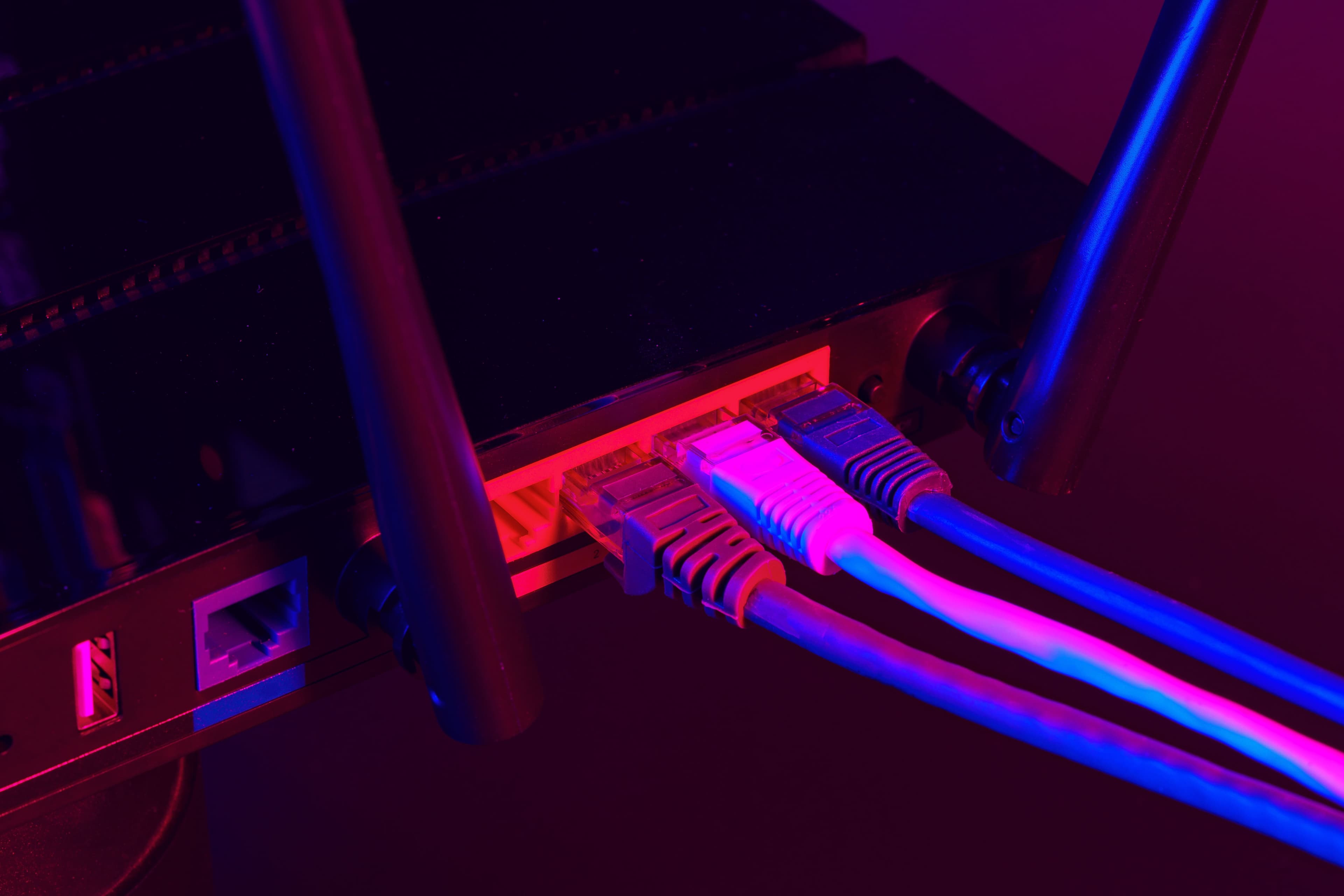 cables-plugged-in-a-wi-fi-router-on-dark-backgroun-2025-02-25-03-23-33-utc.jpg